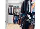 Walk-in closet offers ample storage with custom shelving and rods, a dream for organization at 8731 Betty St, Port Richey, FL 34668