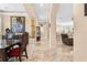 Spacious hallway with arched entryways, decorative vases, tile flooring, and views of adjoining rooms at 8731 Betty St, Port Richey, FL 34668