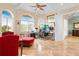 Spacious home office featuring large windows, ample workspace, comfortable seating, and natural light at 8731 Betty St, Port Richey, FL 34668