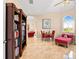 This lovely sitting area features great natural light, elegant flooring, and comfortable seating at 8731 Betty St, Port Richey, FL 34668