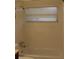 A bright bathroom features a shower-tub combo, updated vanity, and neutral color palette at 9705 45Th N Way, Pinellas Park, FL 33782