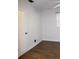 The bright bedroom is enhanced by modern dark wood-look flooring and light from a window at 9705 45Th N Way, Pinellas Park, FL 33782