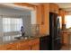 Charming kitchen showcases a granite countertop, stainless steel appliances, stylish wooden trim and ample cabinet space at 9705 45Th N Way, Pinellas Park, FL 33782