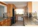 Gourmet kitchen featuring modern appliances, granite counters and ample cabinetry at 9705 45Th N Way, Pinellas Park, FL 33782