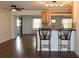 Open kitchen with stainless steel appliances and breakfast bar with seating at 9705 45Th N Way, Pinellas Park, FL 33782