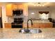 Updated kitchen features stainless appliances, granite countertops, breakfast bar and mosaic tile backsplash at 9705 45Th N Way, Pinellas Park, FL 33782