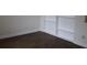 Living room with hardwood floors, white trim, and built-in shelving at 9705 45Th N Way, Pinellas Park, FL 33782