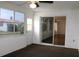 The sunroom has brown carpet, access to the backyard, and access to the main house at 9705 45Th N Way, Pinellas Park, FL 33782