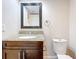 Bathroom featuring granite countertop, modern toilet, and neutral decor at 225 Country Club Dr # 1611, Largo, FL 33771