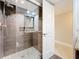 Modern bathroom with glass-enclosed shower and decorative tile accents at 225 Country Club Dr # 1611, Largo, FL 33771