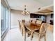 Inviting dining area featuring an elegant chandelier, large table, and seating for eight at 225 Country Club Dr # 1611, Largo, FL 33771