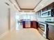 Contemporary kitchen features sleek cabinetry, stainless steel appliances, and a bright, open design at 225 Country Club Dr # 1611, Largo, FL 33771