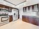 Modern kitchen features stainless steel appliances, granite countertops, and ample cabinet space at 225 Country Club Dr # 1611, Largo, FL 33771
