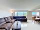 Bright, open living space features tile floors, comfortable seating, and water views at 225 Country Club Dr # 1611, Largo, FL 33771