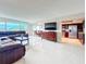 Bright, open living space features tile floors, comfortable seating, and water views at 225 Country Club Dr # 1611, Largo, FL 33771