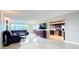 Bright, open living space features tile floors, comfortable seating, and water views at 225 Country Club Dr # 1611, Largo, FL 33771