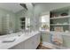 Serene bathroom with a large mirror, ample counter space, and neutral decor at 2850 Deer Run, Tarpon Springs, FL 34688