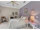 Charming bedroom with floral accents, colorful walls, and antique furnishings at 2850 Deer Run, Tarpon Springs, FL 34688