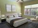 Inviting bedroom with large window, neutral decor, and ample natural light at 2850 Deer Run, Tarpon Springs, FL 34688