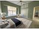 Bright bedroom featuring a window seat, closet, and a cozy armchair, creating a comfortable retreat at 2850 Deer Run, Tarpon Springs, FL 34688
