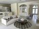 Inviting living room with an open layout, blending seamlessly with the kitchen and dining areas at 2850 Deer Run, Tarpon Springs, FL 34688