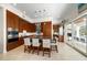 Spacious kitchen with an island, bar seating, and stainless steel appliances, perfect for entertaining guests at 477 20Th Ave, Indian Rocks Beach, FL 33785