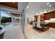 Open kitchen with a seamless transition to outdoor living space, featuring bar seating and a gourmet kitchen at 477 20Th Ave, Indian Rocks Beach, FL 33785