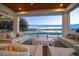 Covered outdoor living space featuring comfortable seating and waterfront views for relaxing and entertaining at 477 20Th Ave, Indian Rocks Beach, FL 33785