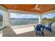 Covered outdoor patio with water view and seating for enjoying the outdoors at 477 20Th Ave, Indian Rocks Beach, FL 33785