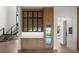 Stylish bar area featuring a wine fridge, custom cabinetry, and marble countertop perfect for entertaining at 5038 W Dickens Ave, Tampa, FL 33629