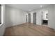 Spacious bedroom features hardwood floors, white walls, and stylish gray doors at 5038 W Dickens Ave, Tampa, FL 33629