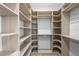 Custom walk-in closet with built in shelves and plenty of space for organization at 5038 W Dickens Ave, Tampa, FL 33629
