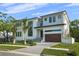 Eye-catching contemporary home with large windows, modern front door, and a well-maintained lawn at 5038 W Dickens Ave, Tampa, FL 33629