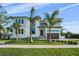 Beautiful two-story house featuring modern design, lush lawn, and professional landscaping at 5038 W Dickens Ave, Tampa, FL 33629