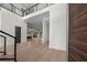 Grand foyer with a modern staircase and hardwood floors throughout at 5038 W Dickens Ave, Tampa, FL 33629