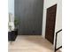 Modern foyer with a statement wall, sleek console, and stylish front door at 5038 W Dickens Ave, Tampa, FL 33629