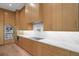 Chef's kitchen featuring custom cabinetry, marble countertops, and stainless steel appliances at 5038 W Dickens Ave, Tampa, FL 33629