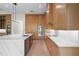 Well-lit kitchen showcases custom wood cabinetry, marble countertops, and stainless steel appliances at 5038 W Dickens Ave, Tampa, FL 33629