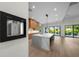 Bright, spacious kitchen with large marble island and access to backyard with floor-to-ceiling sliding doors at 5038 W Dickens Ave, Tampa, FL 33629