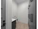 This is a neutral laundry room with storage, light wood floors and front load washer and dryer hookups at 5038 W Dickens Ave, Tampa, FL 33629
