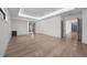 Spacious living room with hardwood floors, modern lighting, and a built-in beverage cooler at 5038 W Dickens Ave, Tampa, FL 33629