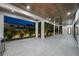 Expansive outdoor space with wood ceiling, recessed lighting, and manicured landscaping at 5038 W Dickens Ave, Tampa, FL 33629