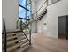 Bright, open staircase with modern railing and abundant natural light from large windows at 5038 W Dickens Ave, Tampa, FL 33629