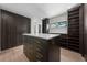 Custom walk-in closet with shelving, drawers, and a center island at 5038 W Dickens Ave, Tampa, FL 33629