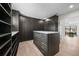Walk-in closet with custom shelving, drawers, and a center island for storage at 5038 W Dickens Ave, Tampa, FL 33629