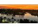 Stunning sunset view of a waterfront city skyline with marina at 670 Island Way # 500, Clearwater Beach, FL 33767