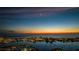 Dramatic sunset view of city skyline, ocean and illuminated buildings at 670 Island Way # 500, Clearwater Beach, FL 33767