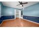 Spacious bedroom features wood floors and a closet for ample storage space at 705 Whiteway Dr, Brooksville, FL 34601