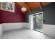 Bright dining room featuring neutral tile flooring and a sliding glass door to the backyard at 705 Whiteway Dr, Brooksville, FL 34601