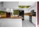 Modern kitchen featuring white cabinetry, butcher block countertops, and stainless steel appliances at 705 Whiteway Dr, Brooksville, FL 34601